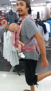 AJ wearing Ziggy through the mall.