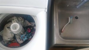 This is our set up - scrubbing brush, laundry tub and washing machine.