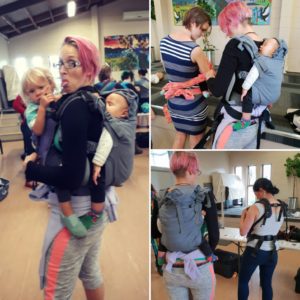 Babywearing, while helping other parents to babywear.